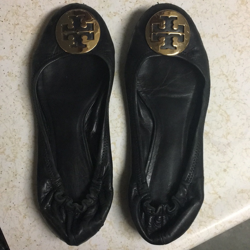 Tory Burch black flats with gold medallion, 8 1/2